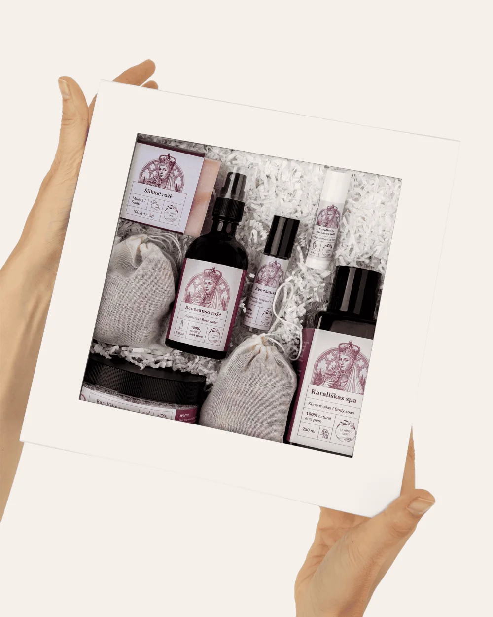 “Renaissance Rose” rose SPA gift set in a white box with a window, held in hands